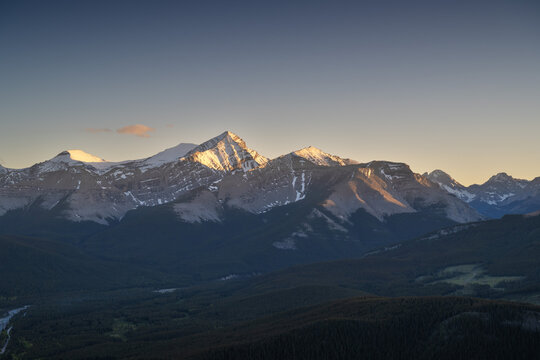 Beautiful views of the Canadian Rockies with picturesque clouds and rivers in the distance 