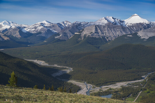 Beautiful views of the Canadian Rockies with picturesque clouds and rivers in the distance 