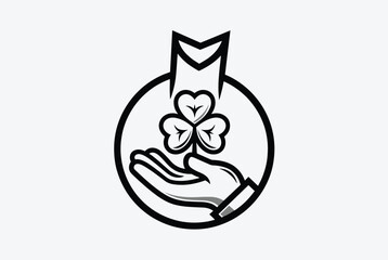 Fototapeta premium Stylized black and white icon of a hand holding a three leaf clover symbol inside a circular frame on a plain light grey background for a logo.