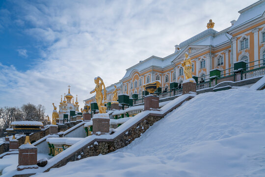 Saint Petersburg, Russia, February 16, 2025: The Grand Cascade Fountain and the Grand Peterhof Palace in the Lower Park of Peterhof on a sunny winter day