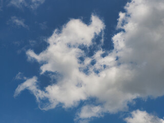 Obraz premium Cumulus clouds, or good weather clouds, appear on sunny days and have a soft, cotton-like appearance with a flat base.