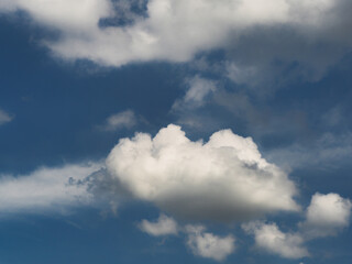 Obraz premium Cumulus clouds, or good weather clouds, appear on sunny days and have a soft, cotton-like appearance with a flat base.