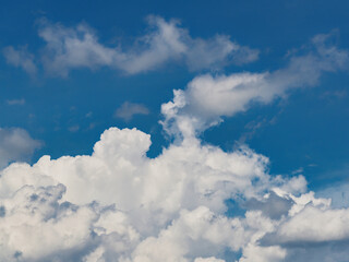 Obraz premium Cumulus clouds, or good weather clouds, appear on sunny days and have a soft, cotton-like appearance with a flat base.