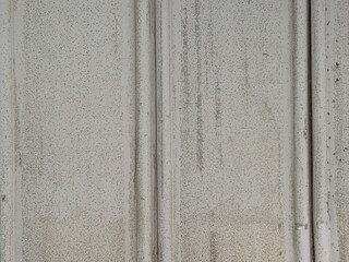 Fototapeta premium Weathered white vertical textured industrial wall background in Sapporo