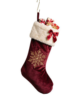 Burgundy velvet Christmas stocking stuffed with wrapped gift boxes hanging