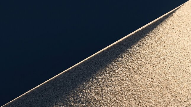 Minimalist two-tone quartz sand diagonal ridge with hidden raking light