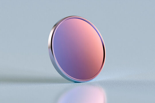 Circular lens with gradient pink to purple hue. Metal rim reflects soft ambient light. Glass surface gleams with gentle sheen. Minimalist background enhances object's elegance
