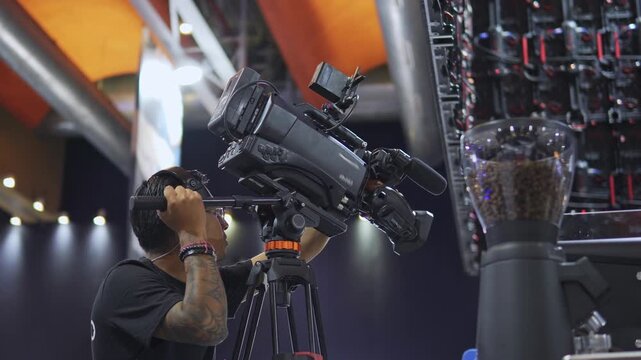 Professional camera operator broadcasting live event