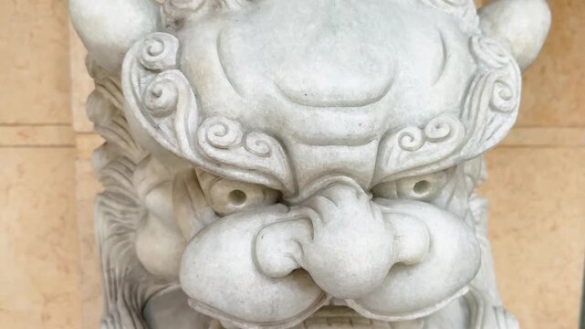 Traditional Vietnamese Nghe Lion guardian stone sculpture close up. Mythological creature entrance decoration