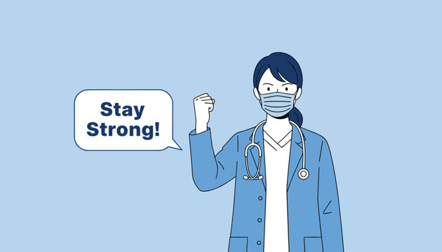 Female medical professional in a lab coat and mask showing a strong fist to encourage everyone to stay strong.