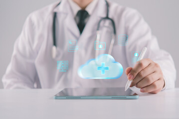 Fototapeta premium Medical cloud computing network hologram on tablet doctor managing patient clinical data storage electronic health record workflow automation and digital transformation in modern hospital