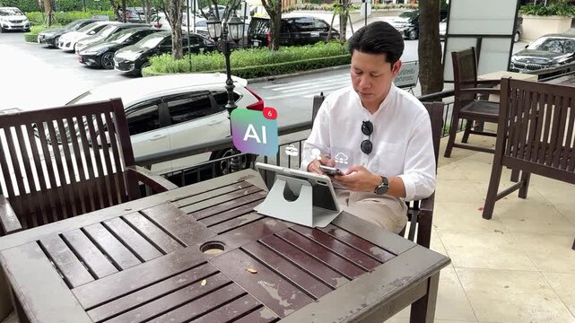 Full HD alternate angle of a mature Asian man at an outdoor cafe table, utilizing a smartphone with interactive AI financial analytics icons.