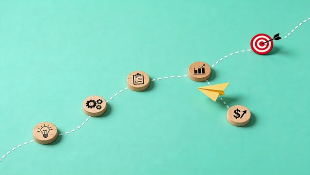Creative business strategy path with wooden coins showing idea to target goal, financial growth process