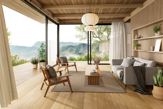 Spacious and airy living room interior with glass doors opening onto a wide wooden deck with a stunning panoramic mountain view 3d render.