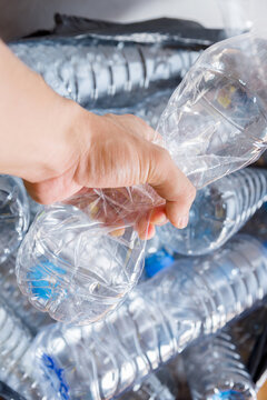 Plastic bottles in black garbage bags waiting to be taken to recycle.