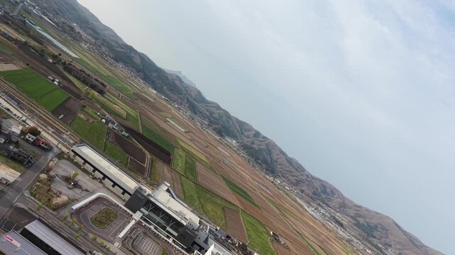 HOKKAIDO, JAPAN.Rural town area with transport lines and open fields April 26 2026