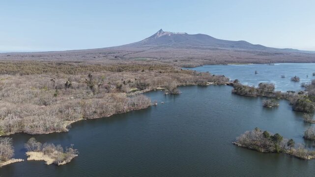 HOKKAIDO, JAPAN.Natural park with scenic lake and volcanic peaks April 26 2026