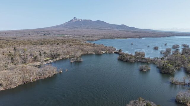 HOKKAIDO, JAPAN.Natural park with scenic lake and volcanic peaks April 26 2026