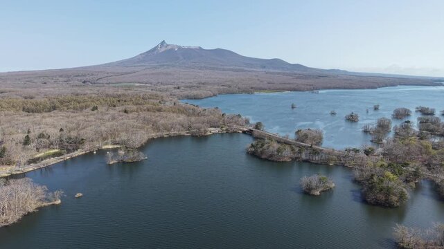 HOKKAIDO, JAPAN.Natural park with scenic lake and volcanic peaks April 26 2026