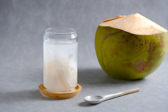 A Glass of Iced Sweet Coconut Drink, Es Kelapa Muda, for Ramadan Iftar. Cocos nucifera L, rich in electrolytes and natural hydration. 