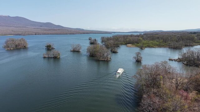 HOKKAIDO, JAPAN.Natural park with scenic lake and volcanic peaks April 26 2026