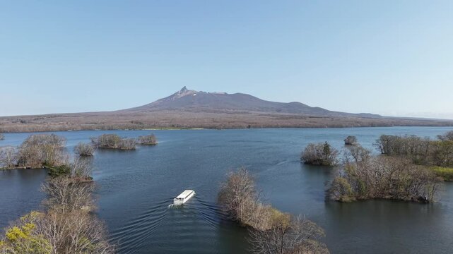 HOKKAIDO, JAPAN.Natural park with scenic lake and volcanic peaks April 26 2026
