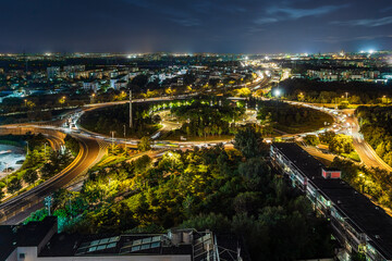 Obraz premium Night view of Xiguan Island in Changping District, Beijing, China; traffic flow and light effects; urban development.