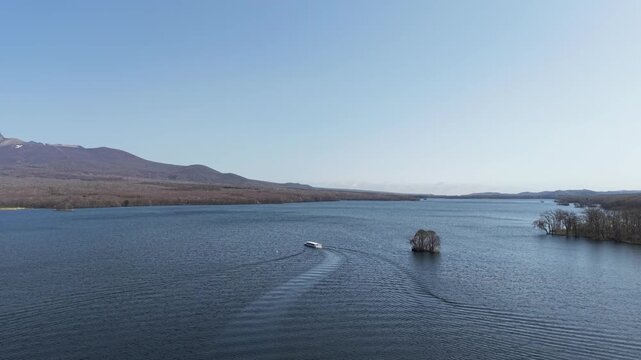 HOKKAIDO, JAPAN.Natural park with scenic lake and volcanic peaks April 26 2026