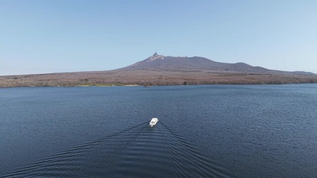 HOKKAIDO, JAPAN.Natural park with scenic lake and volcanic peaks April 26 2026