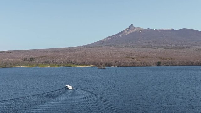 HOKKAIDO, JAPAN.Natural park with scenic lake and volcanic peaks April 26 2026