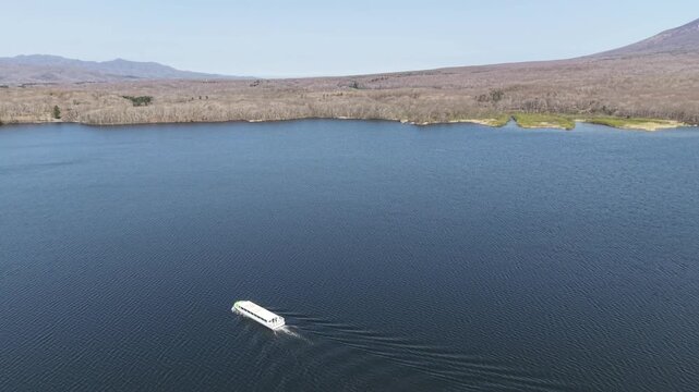 HOKKAIDO, JAPAN.Natural park with scenic lake and volcanic peaks April 26 2026