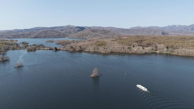 HOKKAIDO, JAPAN.Natural park with scenic lake and volcanic peaks April 26 2026