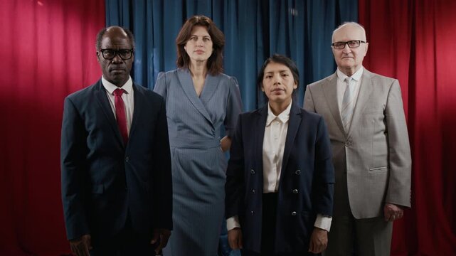 Portrait of diverse multiethnic group of politicians standing together, looking at camera. Footage is suitable for international relations and political campaign videos
