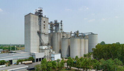 Animal feed factory. Agricultural silos, grain storage silos. Agriculture industry. Rural agribusiness. Grain storage innovation. Agricultural silos at animal feed factory. Sustainable farming. © Fahroni