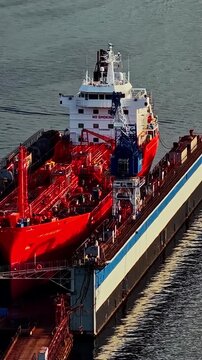 Overhead vertical social ratio aerial video of a docked ship. Produced with Rec709 color.