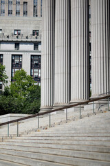 Naklejka premium Stone stairs and tall columns outside a neoclassical building