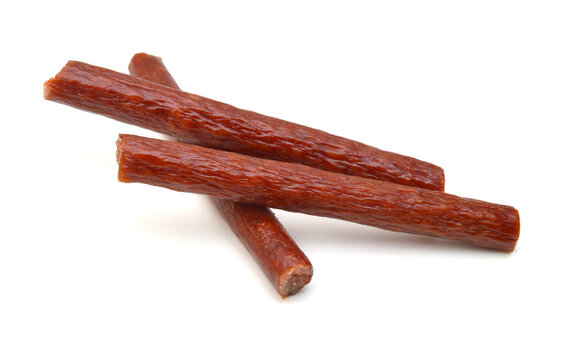 Smoked thin sausages, isolated on white