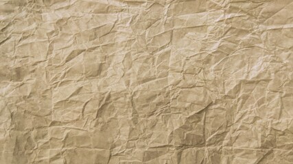 Fototapeta premium Crumpled brown kraft paper texture background
