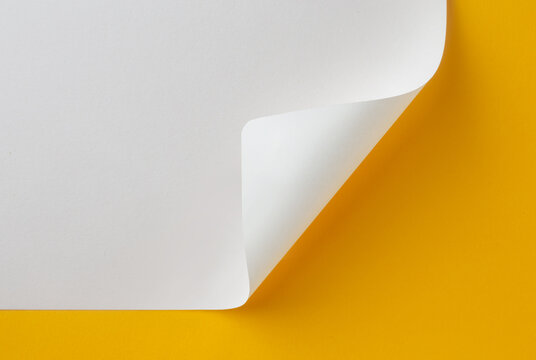 Blank white paper corner page curl with bright yellow background reveal mockup