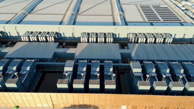 Aerial view of the Google Data Centre showing industrial cooling units and ventilation systems on the rooftop in Cheshunt, England, United Kingdom.