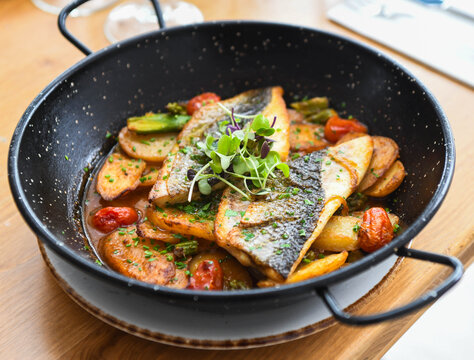 Sea Bream Fillets with Roasted Potatoes and Cherry Tomatoes in a Pan