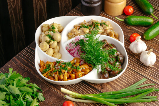 Assorted pickled mushroom platter with fresh vegetables