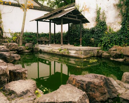 Green China pond landscape with resting area