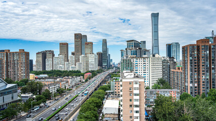 Obraz premium Clear blue sky over Beijing's CBD, showcasing the city skyline and urban traffic and commercial landscape.