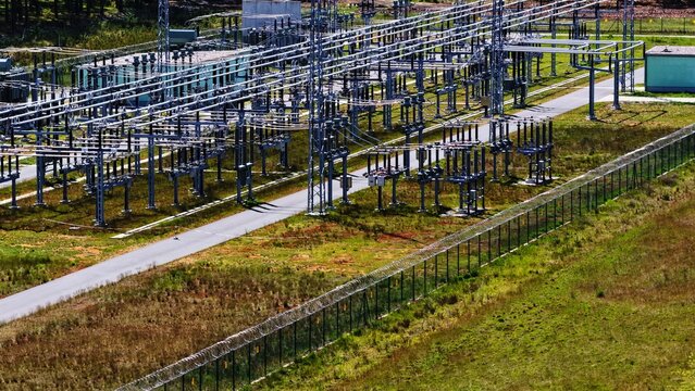 Aerial View of Large Electrical Substation in Forest Landscape