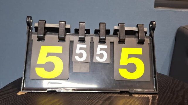 Vintage Flip Scoreboard Showing 5&ndash;5 Tie Score