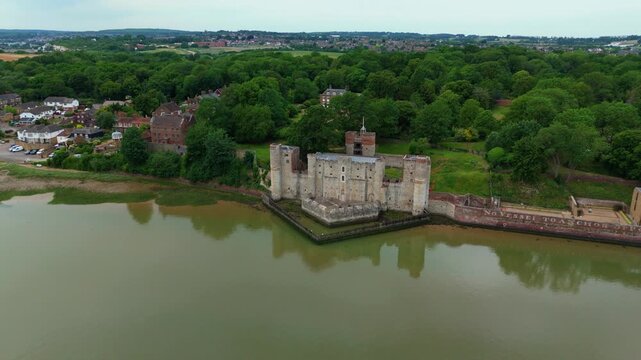 Aerial view of Upnor Castle, an Elizabethan artillery fort on the banks of the River Medway surrounded by lush green trees in Upper Upnor, England, United Kingdom.