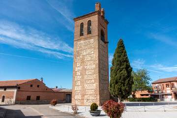 Architectural view of the 13th-century Cistercian main portal with pointed archivolts and a wooden door at the Monastery of Santa Maria de Palazuelos in Corcos del Valle, Valladolid, Castilla y Leon,  © Nandi Estévez