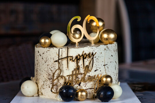 Elegant 60th Birthday Cake With Golden Number and Festive Spheres