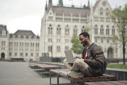 Young man using his laptop in Budapest Hungary